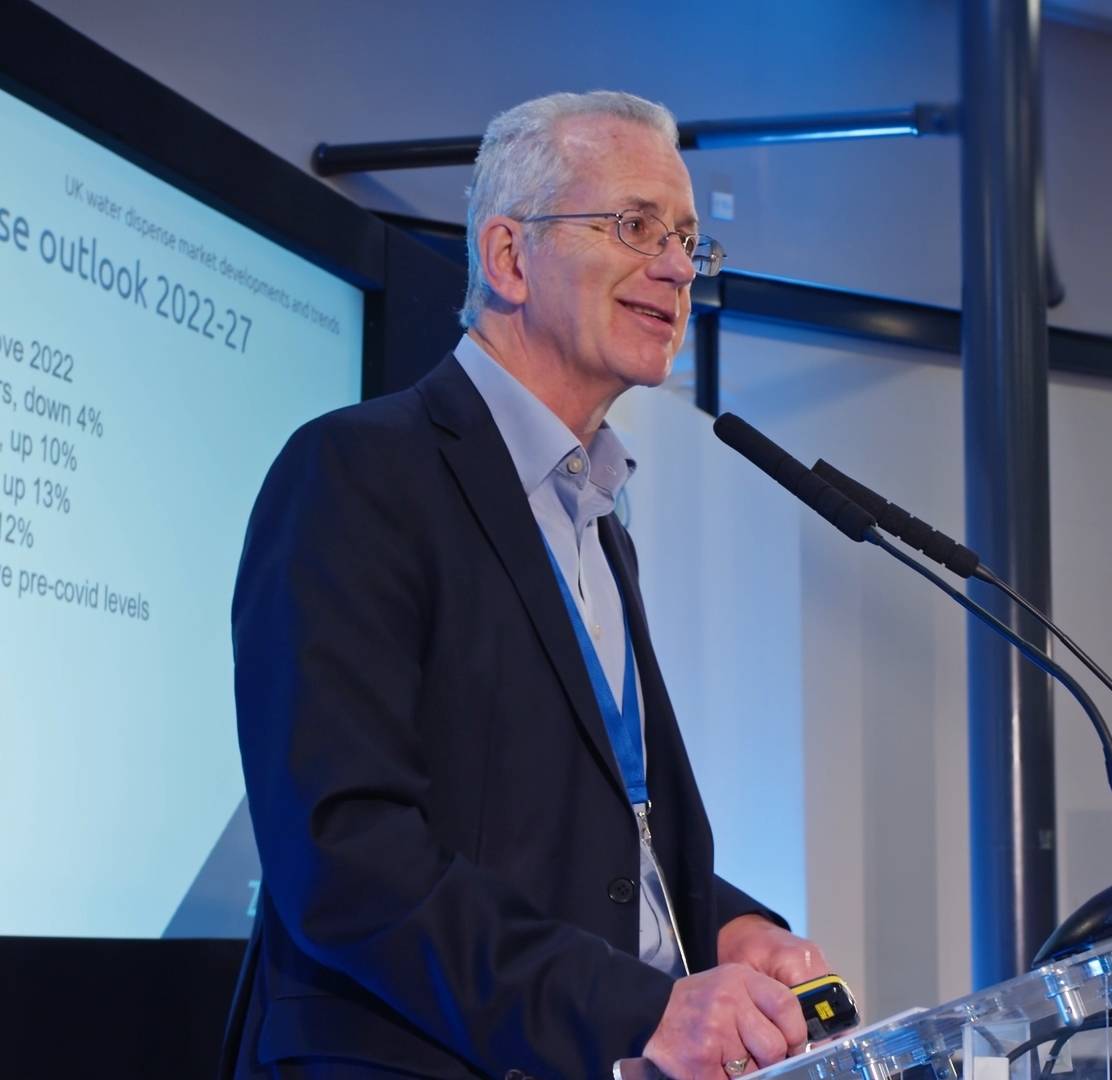 Man speaking at a conference